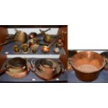 ~ A collection of mainly antique brass and copper cooking wares, including graduated pans and