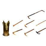 ~ A brass stick stand with loop handles containing six walking sticks and a riding crop, including