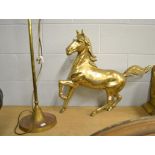 A brass statue of a stallion mid canter, 68cm long together with a brass adjustable table lamp (2)