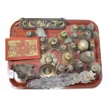 ~ A collection of metalwares etc including a quantity of bronze bells, Eastern Buddha head, two