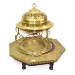 ~ A Continental brass brazier with pierced domed cover and another of octagonal form with studwork