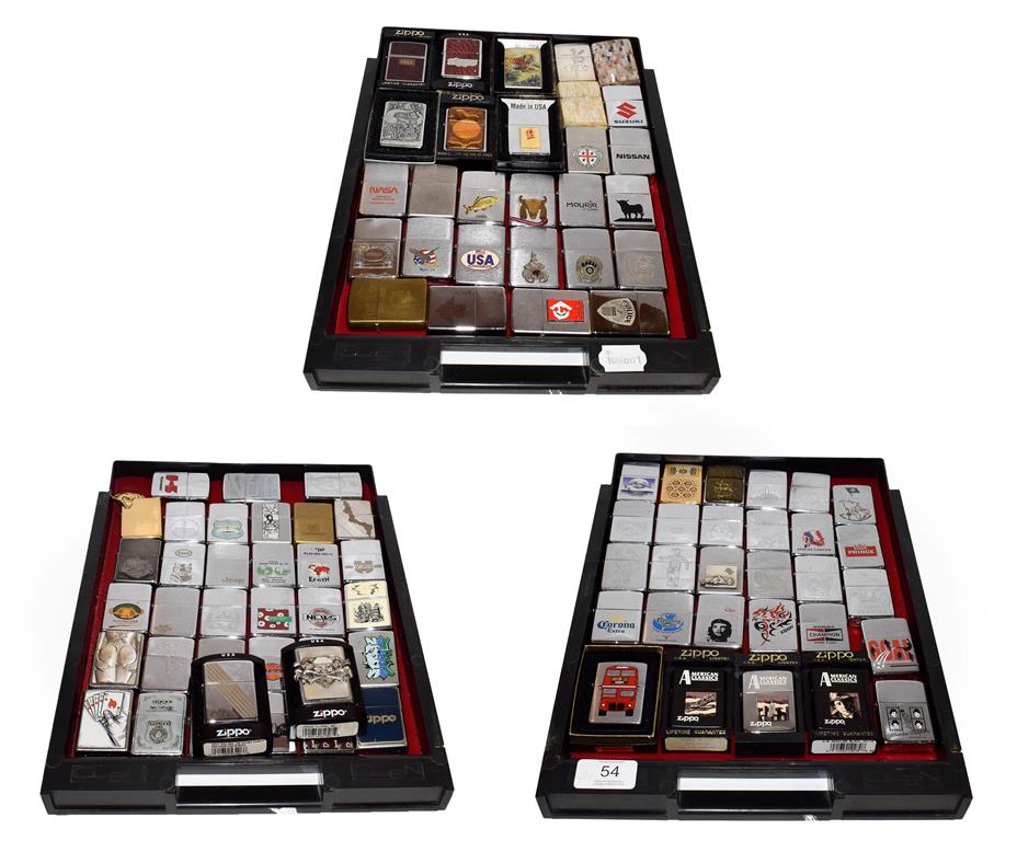 ~ A collection of Zippo lighters including advertising examples (3 trays)