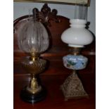 Two Victorian oil lamps, one brass based and the other with an opaline shade (2)