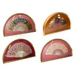 ~ Four fans with mother-of-pearl sticks, each in a gilt framed wall hanging display case, two lace