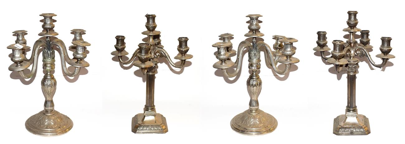 ~ Two pairs of Continental silver plated five branch candelabra, one pair of Corinthian column