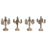 ~ Two pairs of Continental silver plated five branch candelabra, one pair of Corinthian column