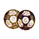 A pair of early 19th century English porcelain plates, Coalport style, decorated with floral sprays,