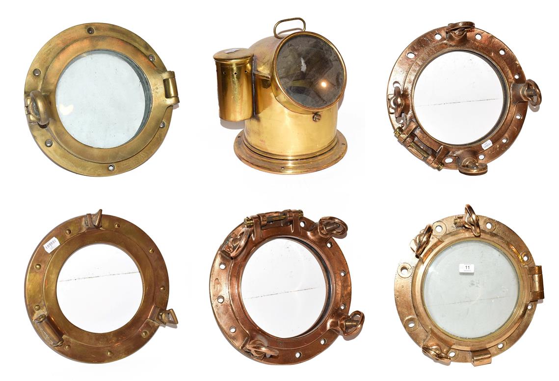 ~ Five brass ships portholes, two with glass, together with a brass cased marine compass on gimble