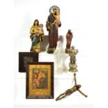~ A leather bound Spanish bible with white metal mounts and a quantity of devotional statues and two