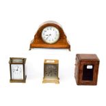 A brass carriage timepiece with fitted travelling case, inlaid mantel timepiece and a brass desk