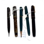 A Parker Vacumatic fountain pen with nib stamped 14K and matching pencil, a Parker fountain pen with