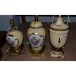 A painted wooden urn formed table lamp and two porcelain examples (3)