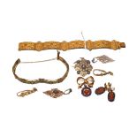 ~ A collection of circa 1900 gilt jewellery including a bracelet formed of floral and scroll