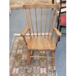 A pine spindle back rocking chair
