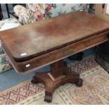 A Regency mahogany fold over tea table on waisted X-form base and scroll feet, 95cm by 47cm by 74cm