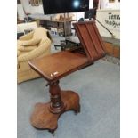 A 19th century mahogany adjustable writing stand, the rectangular top with moulded edge and lift