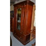 A Victorian mahogany single door wardrobe