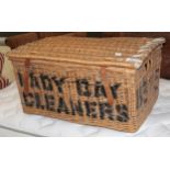 A wicker laundry basket, with stencil decoration, 78cm by 53cm