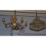 A silvered metal seven branch chandelier ornamented with bacchanalian figures (drop approx 42cm,