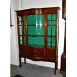 An Edwardian inlaid mahogany serpentine fronted display case, 123cm by 46cm by 176cm high