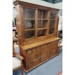 A Barker & Stonehouse Flagstone cabinet, the upper section with glazed doors and shelves, the