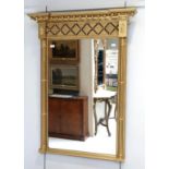 A Regency inverted breakfront mirror (later gilding)