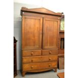 A 19th century oak linen press, the upper section fitted with shelves, 132cm by 56cm by 219cm high