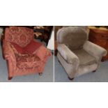 A red upholstered armchair together with another armchair (2)