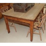 A pine farmhouse kitchen table, 138cm by 96cm by 79cm high