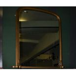 A large gilt framed over-mantel mirror