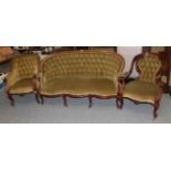 A Victorian mahogany framed sofa upholstered in buttoned green fabric and two similar armchairs (3)