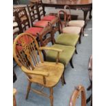 A pair of Regency carved mahogany dining chairs, a pair of Victorian balloon back chairs and a wheel