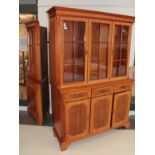 A yew wood veneered glazed bookcase, and a yew wood veneered glazed floor standing corner