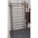 A pair of wrought metal bottle racks, 57cm by approx 135cm