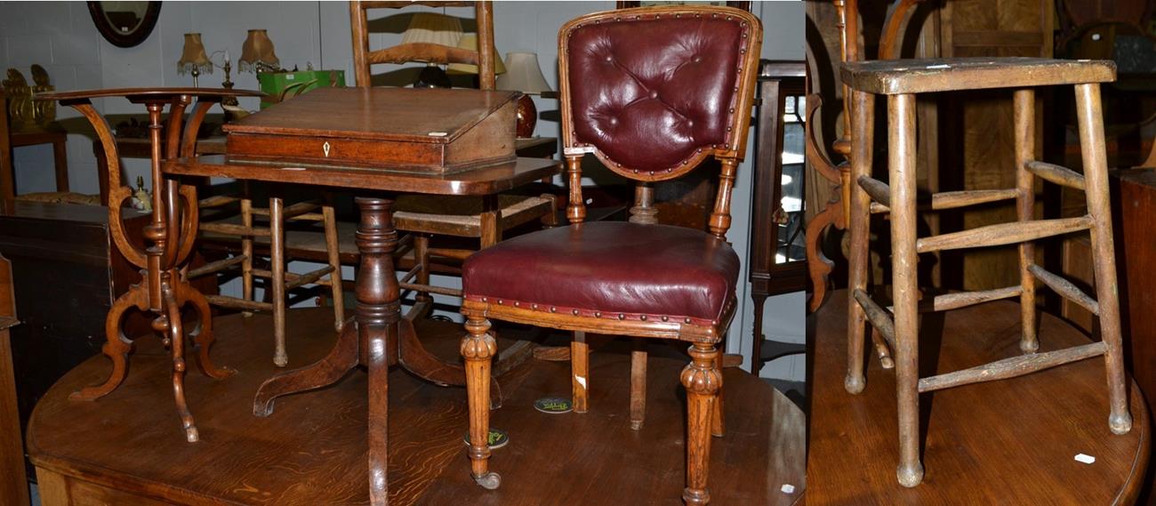 A walnut occasional table, 72cm high, a Georgian oak tripod table, 59cm high, a desk top writing