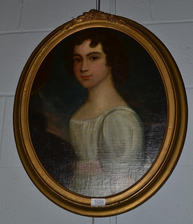 British school 19th century Portrait of a young lady, half length wearing a white dress with pink