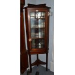 A reproduction inlaid glazed mahogany standing corner cupboard, 54cm by 32cm by 157cm high