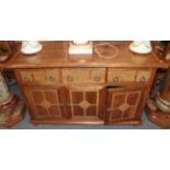 A Barker & Stonehouse Flagstone sideboard fitted with three drawers and three cupboards, 140cm by