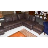 A brown leather corner settee with matching footstool, 230cm by 180cm