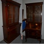 A Victorian mahogany glazed bookcase cabinet, 120cm by 46cm by 202cm high, together with a 1920's