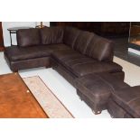 A brown leather corner settee with matching footstool, 230cm by 180cm