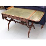 A reproduction leather inset sofa table fitted with two drawers, 93cm closed by 55cm by 72cm