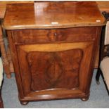 A 19th century walnut cupboard, the shaped top over a frieze drawer above a quarter veneered