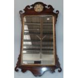 A parcel gilt mahogany fretwork mirror, 93cm by 52cm