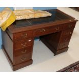 A leather inset oak pedestal desk, 120cm by 60cm by 74cm high