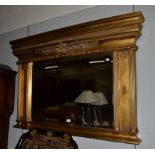 A reproduction gilt framed over mantel mirror, 136cm by 91cm
