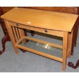 A Treske Furniture bespoke solid oak console table, the bowed rectangular top over a pair of drawers