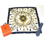 Hermes Silk Scarf 'Les Clefs' Design on cream with a navy border; and a Hermes Silk Tie on light