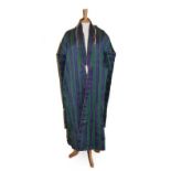 A 20th Century Afghan Purple and Green Striped Chapan, with floral lining similar to those worn by