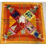 Hermes Silk Scarf 'Le Carnaval de Venise' depicting masked figures within an orange and yellow